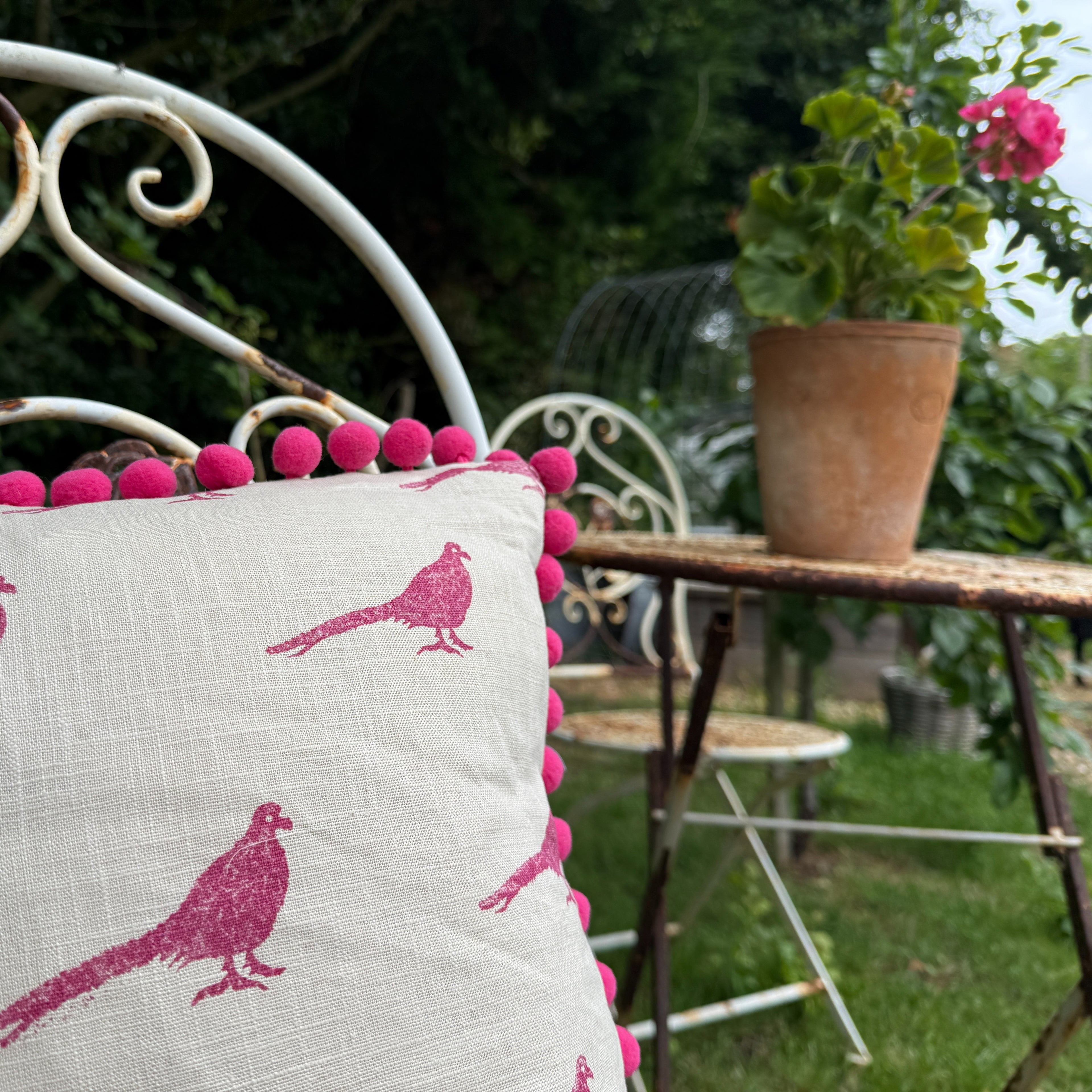 The Bold Pheasant Cushion - Raspbery Pom Pom