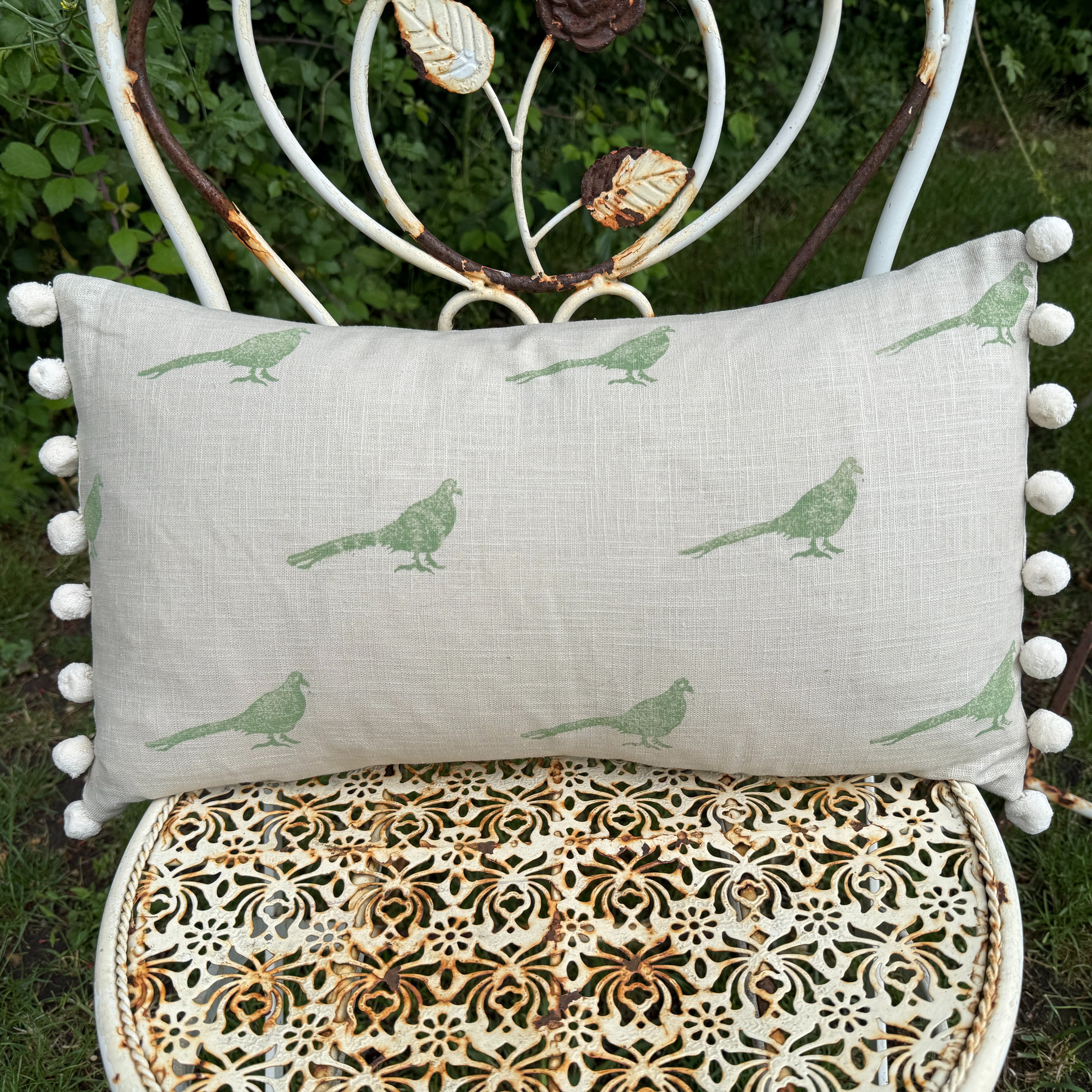 The Bold Pheasant Cushion - Light Green with Cream Pom Poms