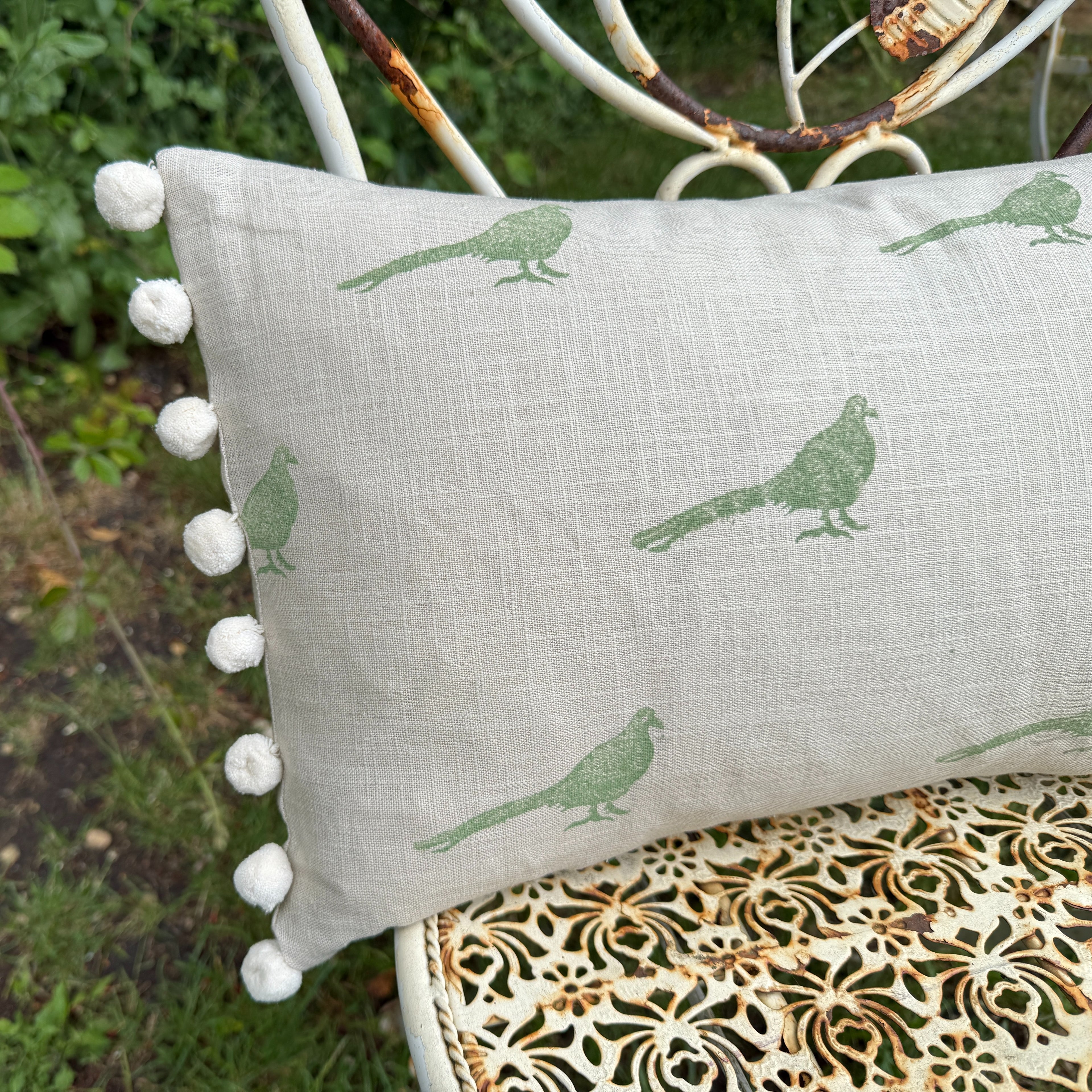 The Bold Pheasant Cushion - Light Green with Cream Pom Poms